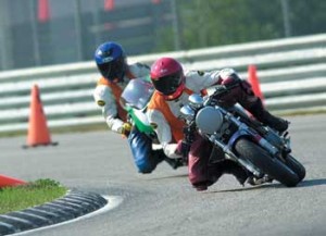 Here I am riding with my friend Paul who is helped get me fast enough to start dragging my knee.